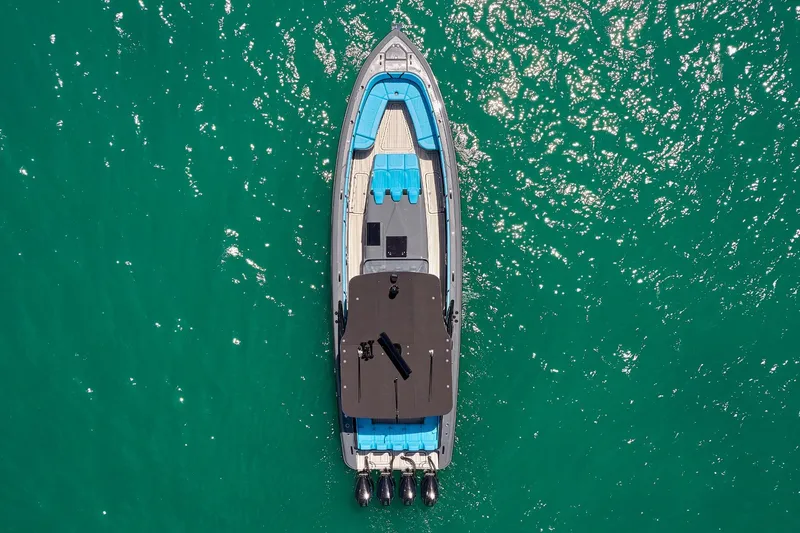  Yacht Photos Pics Aerial view of 2022 Midnight Express 43' Solstice boat on turquoise water.