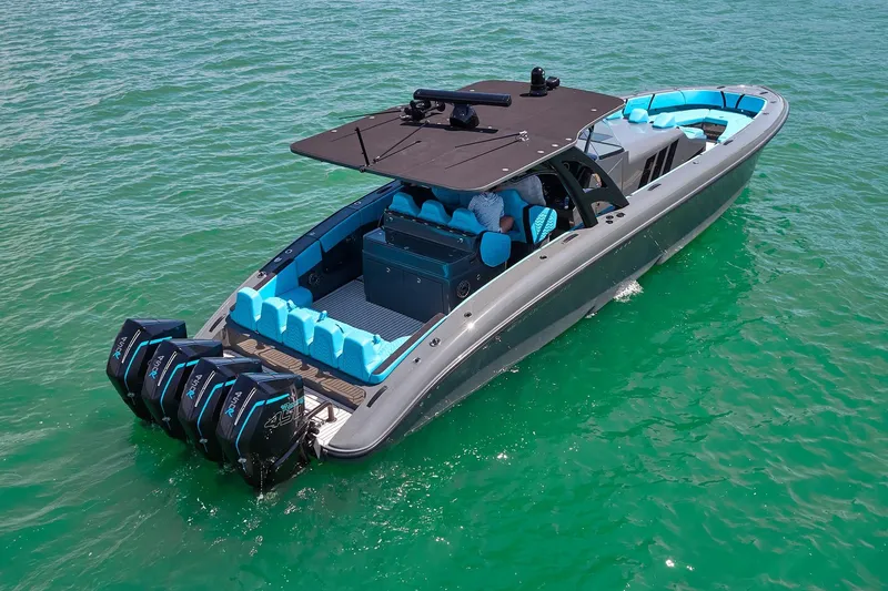  Yacht Photos Pics 2022 Midnight Express 43' Solstice boat with vibrant seating on clear water.