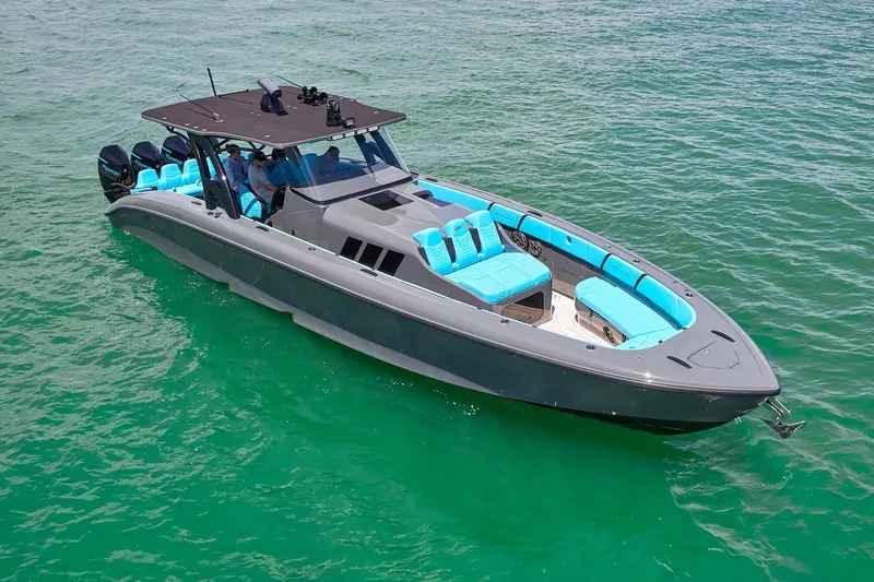  Yacht Photos Pics 2022 Midnight Express 43' Solstice boat with turquoise seating on clear water.