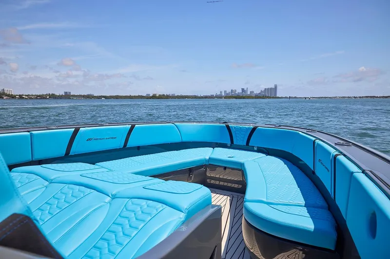  Yacht Photos Pics Luxurious 2022 Midnight Express 43' Solstice boat with turquoise seating, ocean view.