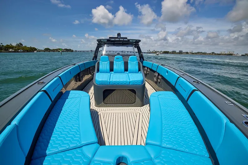  Yacht Photos Pics 2022 Midnight Express 43' Solstice boat with vibrant blue seating on open water.