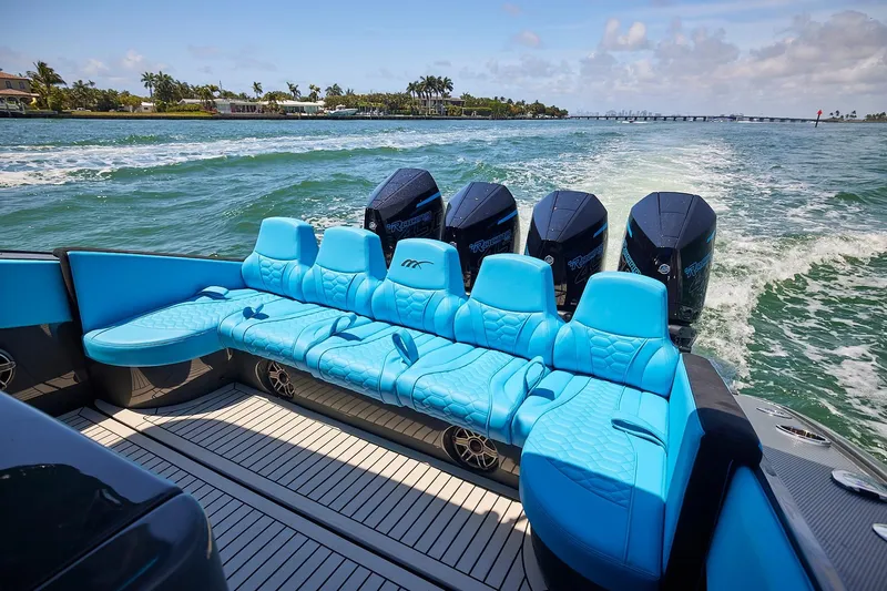  Yacht Photos Pics Luxury 2022 Midnight Express 43' Solstice boat with blue seating and powerful engines on open water.