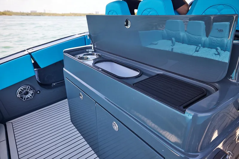  Yacht Photos Pics Luxury 2022 Midnight Express 43' Solstice boat interior with sleek kitchenette and seating.