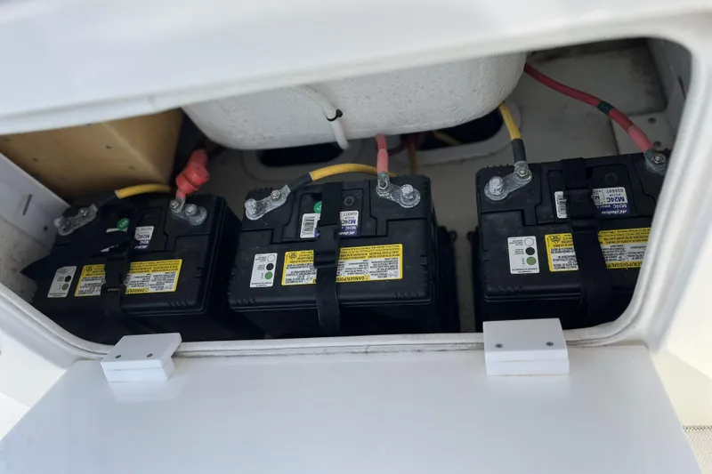  Yacht Photos Pics Three marine batteries in a 2018 Buddy Davis 28 Center Console boat compartment.