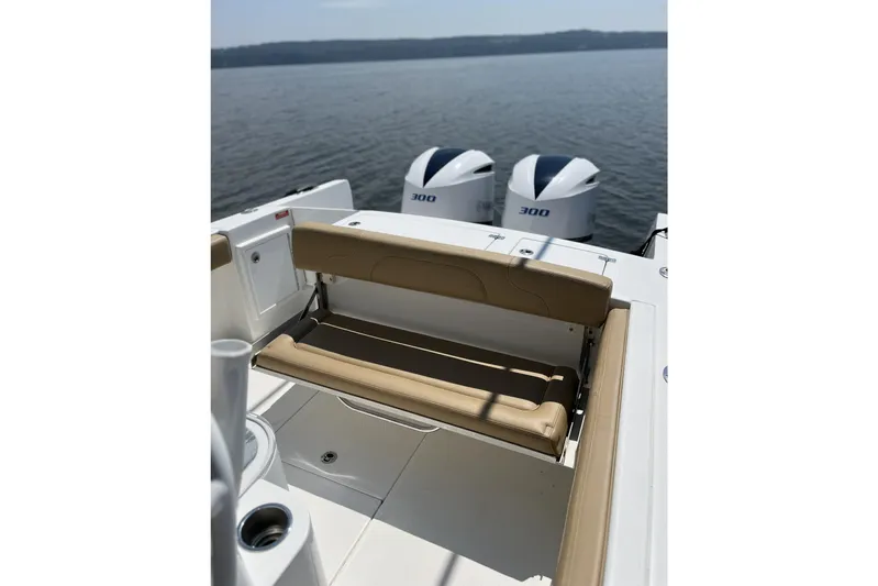 Yacht Photos Pics 2018 Buddy Davis 28 Center Console boat with twin 300 engines, featuring a tan foldable seat.