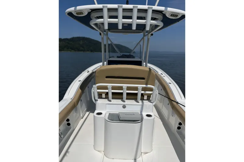  Yacht Photos Pics 2018 Buddy Davis 28 Center Console boat on calm water, featuring sleek design and spacious deck.
