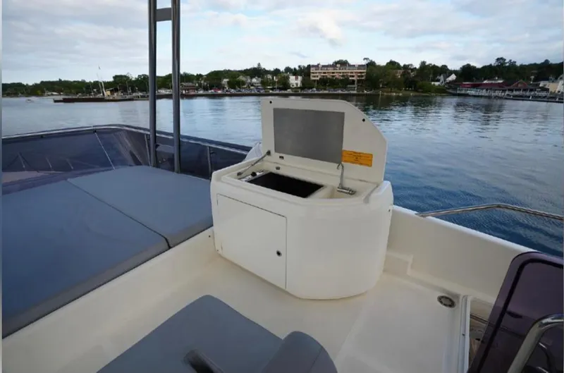  Yacht Photos Pics Ferretti Yachts 550 2016 model, outdoor deck with built-in grill, scenic waterfront view.