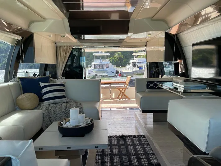  Yacht Photos Pics Luxurious interior of 2016 Ferretti Yachts 550 with modern furnishings and scenic marina view.
