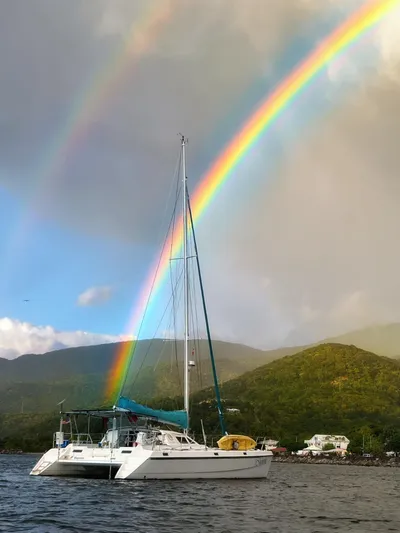 Majestic Yacht Photos Pics Sailing catamaran St Francis 44 MKII under vibrant rainbow, 1999 model.