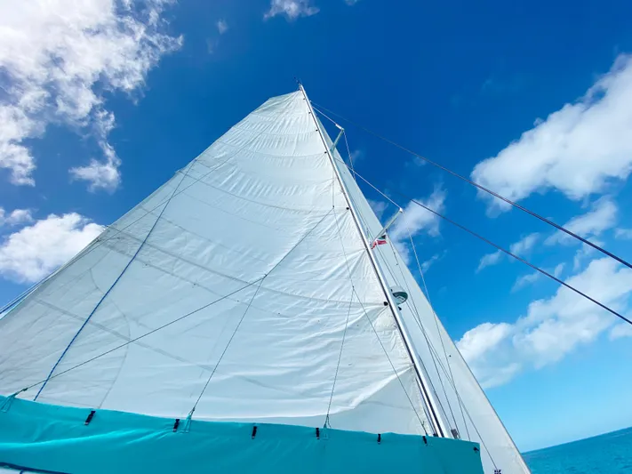 Majestic Yacht Photos Pics Sailing yacht St Francis 44 MKII, 1999 model, with white sails against a blue sky.