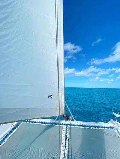 Majestic Yacht Photos Pics Sailing on a 1999 St Francis 44 MKII catamaran under clear blue skies.