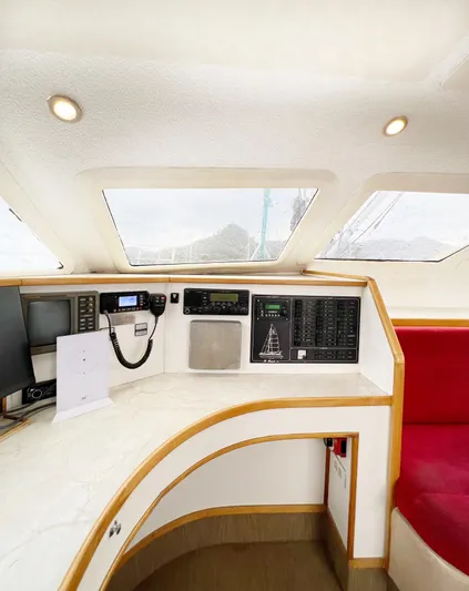 Majestic Yacht Photos Pics Interior of 1999 St Francis 44 MKII yacht with navigation equipment and red seating.