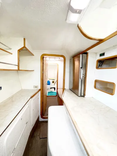 Majestic Yacht Photos Pics Interior of 1999 St Francis 44 MKII yacht, featuring modern kitchen with white cabinetry.