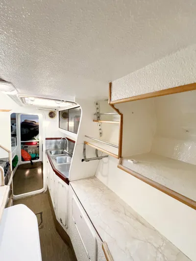 Majestic Yacht Photos Pics Interior of 1999 St Francis 44 MKII yacht with kitchen and storage shelves.