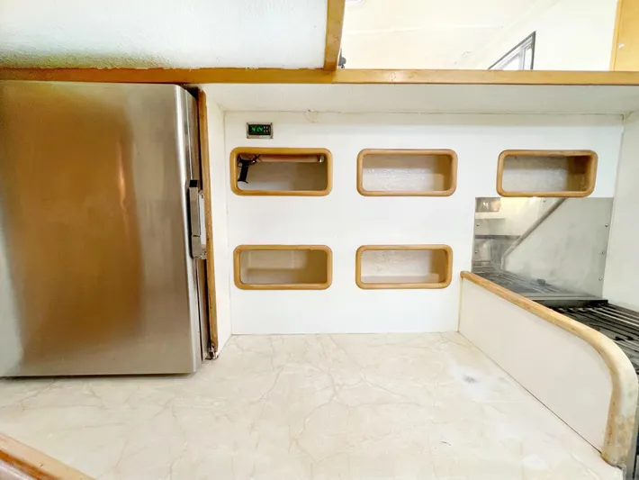 Majestic Yacht Photos Pics Interior of 1999 St Francis 44 MKII yacht with fridge and storage compartments.