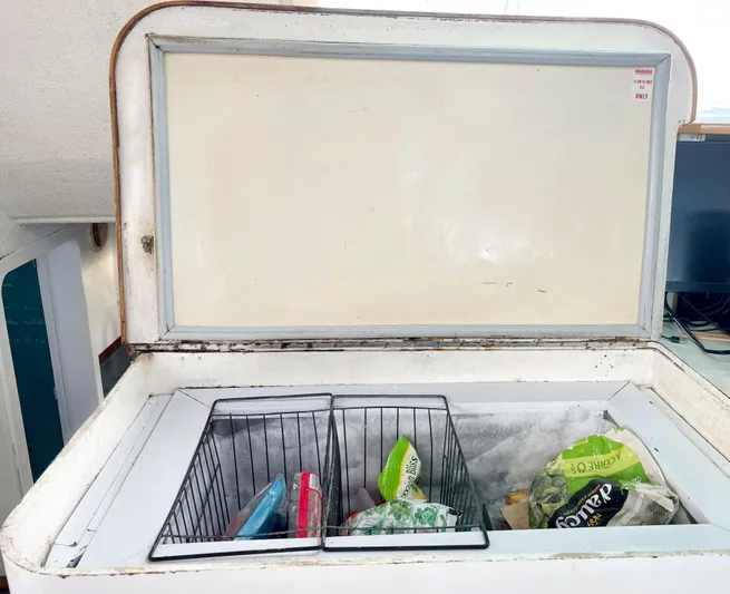 Majestic Yacht Photos Pics Open freezer on 1999 St Francis 44 MKII yacht with various frozen foods.