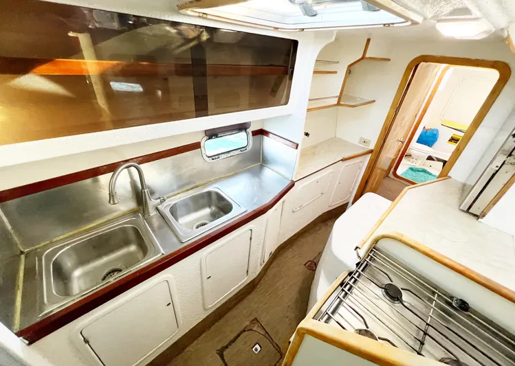 Majestic Yacht Photos Pics Spacious kitchen in 1999 St Francis 44 MKII yacht with dual sinks and stove.