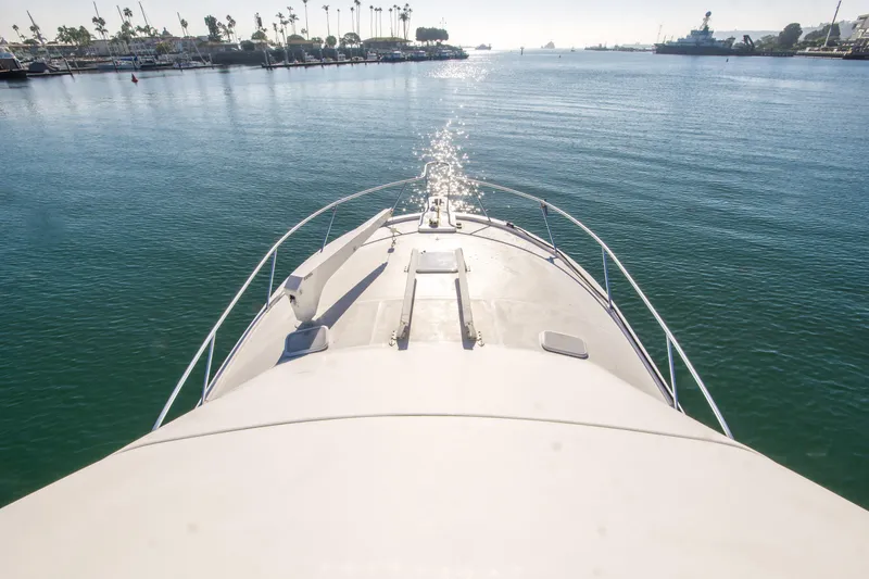 Lost Boys Yacht Photos Pics Bow view of 2002 Luhrs 36 Convertible yacht on calm water.