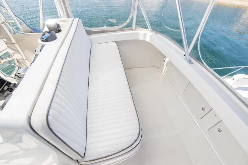 Lost Boys Yacht Photos Pics 2002 Luhrs 36 Convertible boat interior with white seating and ocean view.