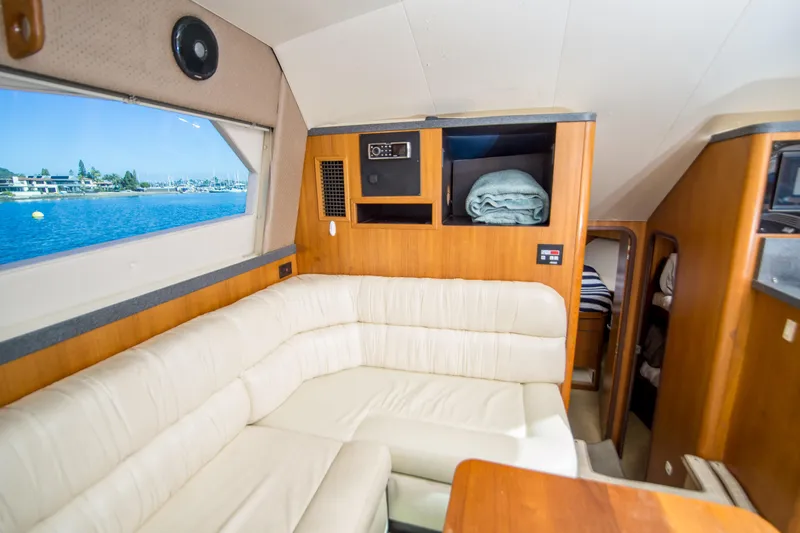 Lost Boys Yacht Photos Pics 2002 Luhrs 36 Convertible yacht interior with cream leather seating and ocean view.