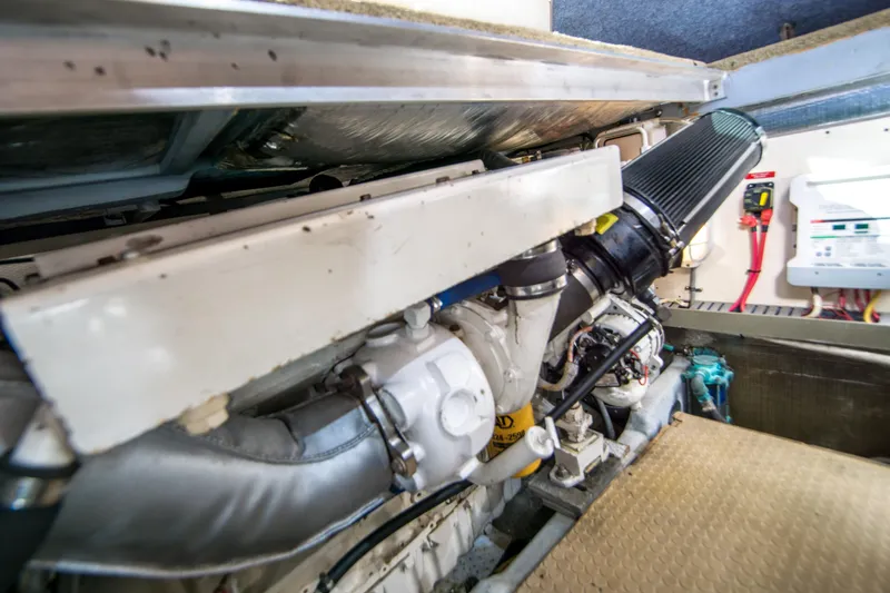 Lost Boys Yacht Photos Pics Engine room of 2002 Luhrs 36 Convertible boat, showcasing mechanical components and wiring.