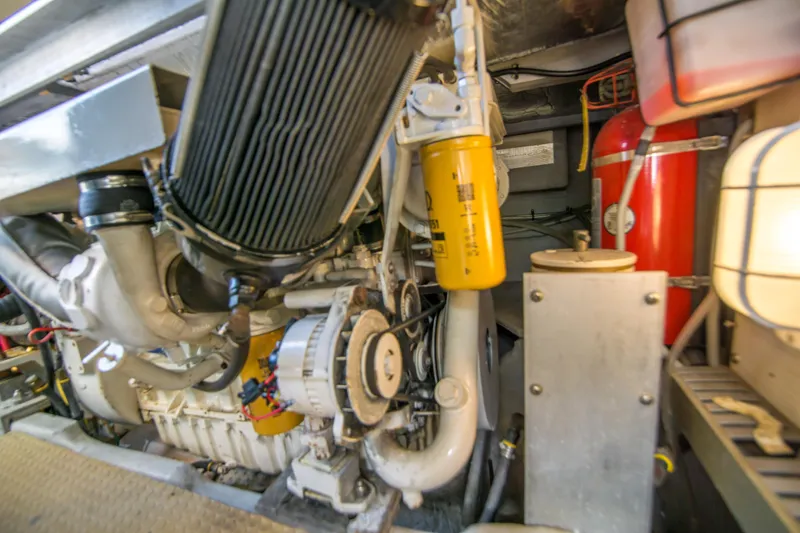 Lost Boys Yacht Photos Pics Engine room of 2002 Luhrs 36 Convertible boat, showcasing mechanical components.