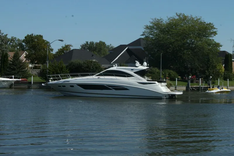  Yacht Photos Pics 2014 Sea Ray 510 Sundancer yacht docked near waterfront homes.