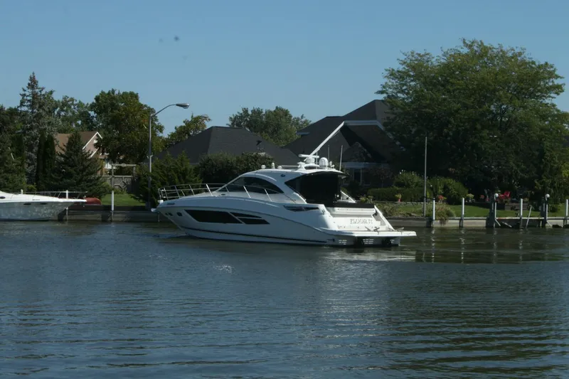  Yacht Photos Pics 2014 Sea Ray 510 Sundancer yacht docked near waterfront homes.