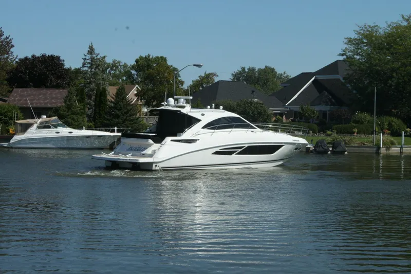  Yacht Photos Pics 2014 Sea Ray 510 Sundancer yacht cruising on a calm residential waterway.