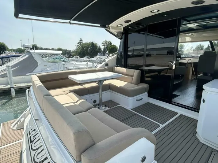  Yacht Photos Pics 2014 Sea Ray 510 Sundancer yacht with spacious outdoor seating and table.