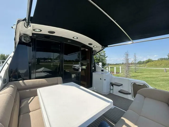  Yacht Photos Pics 2014 Sea Ray 510 Sundancer yacht with outdoor seating and canopy, docked in a scenic area.