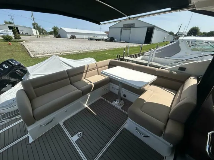  Yacht Photos Pics 2014 Sea Ray 510 Sundancer yacht with spacious outdoor seating and table.