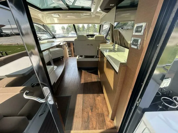  Yacht Photos Pics Interior of 2014 Sea Ray 510 Sundancer yacht with modern design and wood flooring.