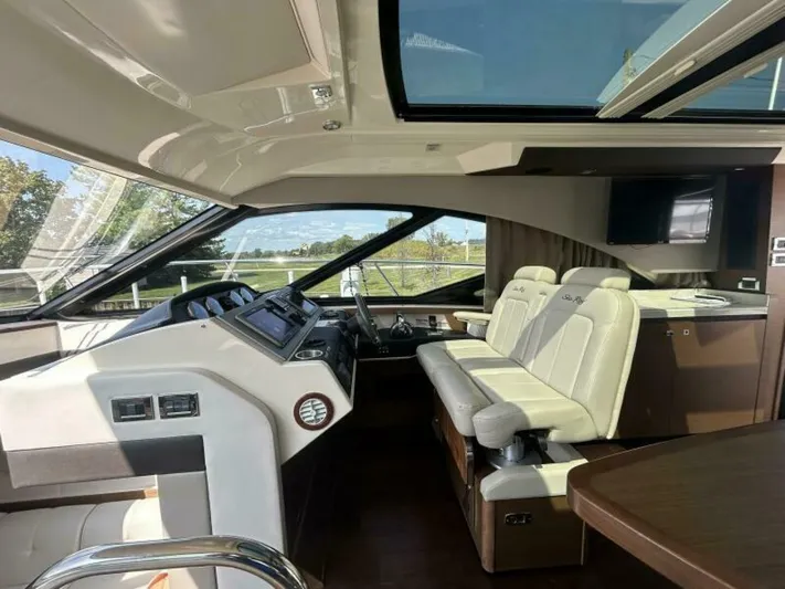  Yacht Photos Pics 2014 Sea Ray 510 Sundancer yacht interior with modern helm and luxurious seating.