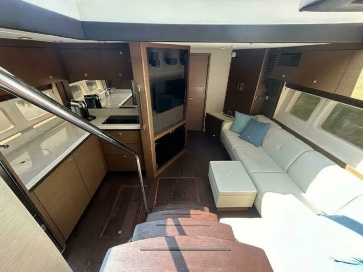  Yacht Photos Pics Luxurious interior of 2014 Sea Ray 510 Sundancer yacht with modern kitchen and seating area.