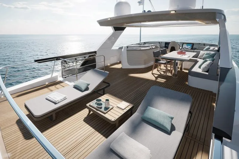  Yacht Photos Pics Luxurious 2026 Absolute Navetta 66 yacht deck with sun loungers and ocean view.