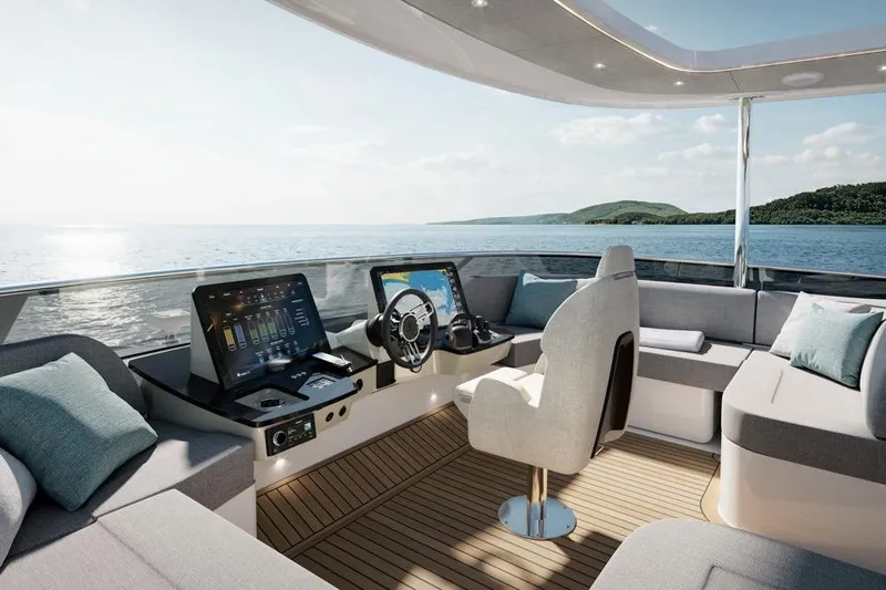  Yacht Photos Pics Luxurious 2026 Absolute Navetta 66 yacht cockpit with modern controls and panoramic ocean view.