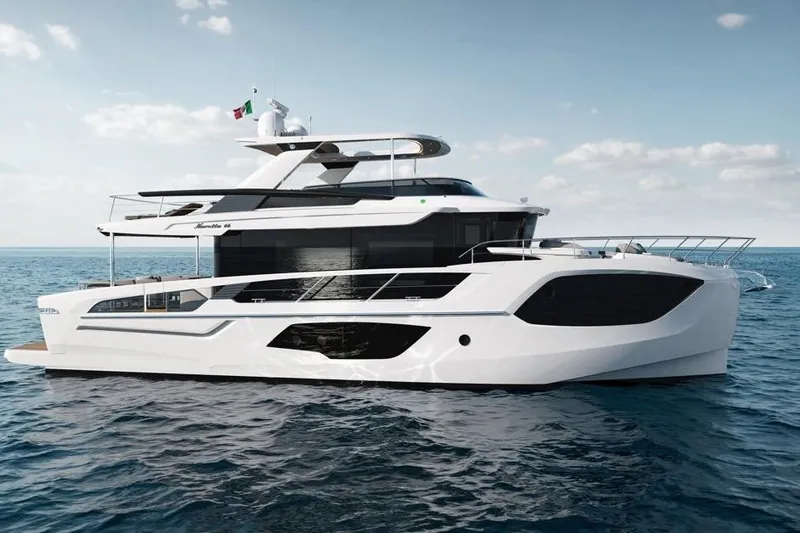  Yacht Photos Pics 2026 Absolute Navetta 66 yacht cruising on open sea under clear skies.