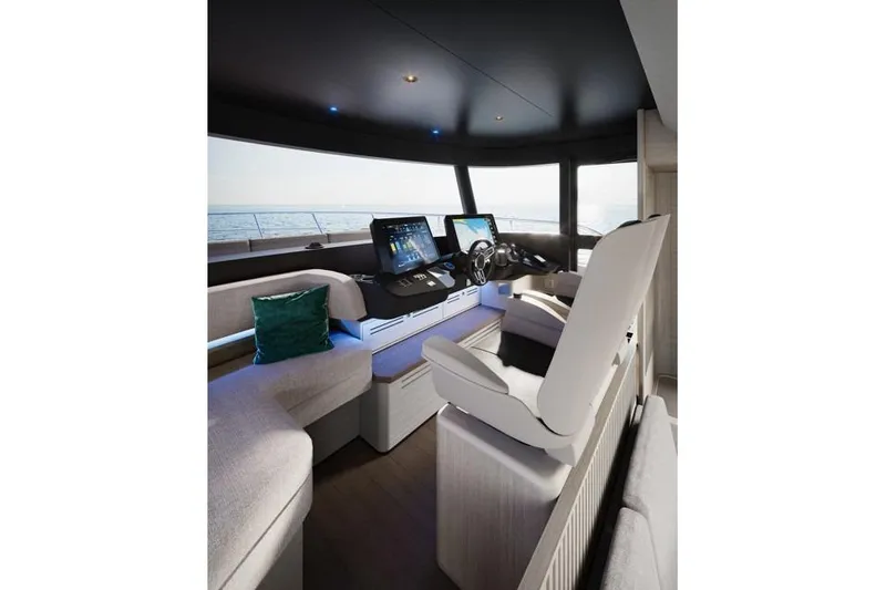  Yacht Photos Pics Luxurious helm of 2026 Absolute Navetta 66 yacht with modern controls and seating.