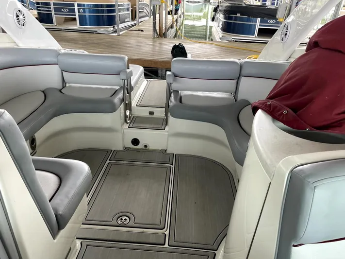 New Engines 2021 Yacht Photos Pics Interior of a 2005 Cobalt 360 boat with gray seating and wood flooring.