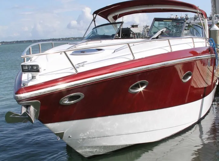 New Engines 2021 Yacht Photos Pics 2005 Cobalt 360 boat with red and white exterior docked on calm water.