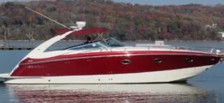 New Engines 2021 Yacht Photos Pics 2005 Cobalt 360 boat with red and white design on a calm lake.