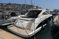 Astondoa 53 Open 2007 yacht docked in marina, rear view with open deck.
