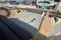 2007 Astondoa 53 Open yacht with spacious deck and seating area in marina.