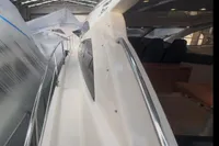 Astondoa 53 Open 2007 yacht in a warehouse, showcasing sleek design and polished railings.