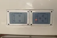 Control panel on a 2007 Astondoa 53 Open yacht, featuring labeled buttons and indicators.