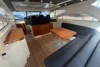 Interior of 2007 Astondoa 53 Open yacht with sleek seating and wooden accents.