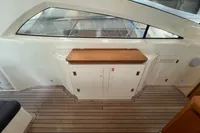 Astondoa 53 Open 2007 yacht interior with wooden flooring and storage cabinets.