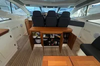 Interior of 2007 Astondoa 53 Open yacht with wooden flooring and open cabinets.