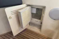 Open storage compartment on 2007 Astondoa 53 Open yacht, featuring wooden flooring.